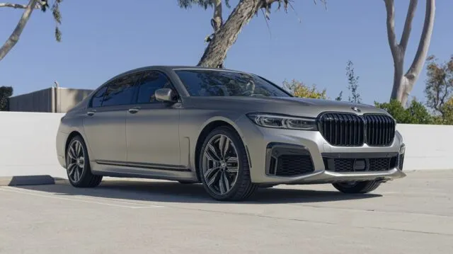 BMW 7 Series M760i Matte Gray PPF Front 3 4 Low Angle Trees