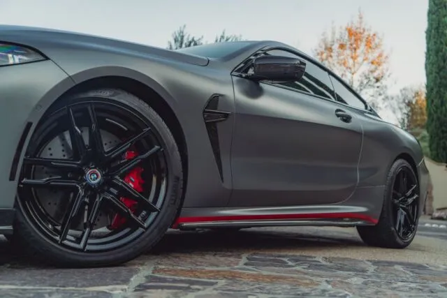 BMW M8 Competition Matte Grey Vinyl Wrap Black Wheel Red Brake Carbon Mirror Side Detail