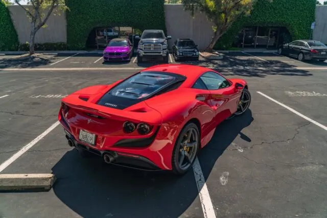 Ferrari F8 Tributo Red PPF Rear Overhead Parking Lot Purple BMW Background