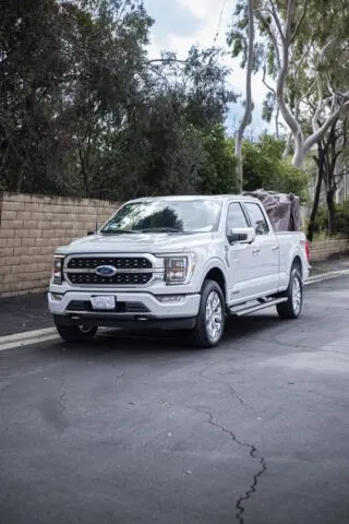 Ford F 150 Platinum White PPF Front 3Quarter Vertical Street Trees
