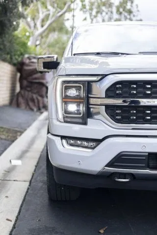 Ford F 150 Platinum White PPF Headlight Grille Front Close Up