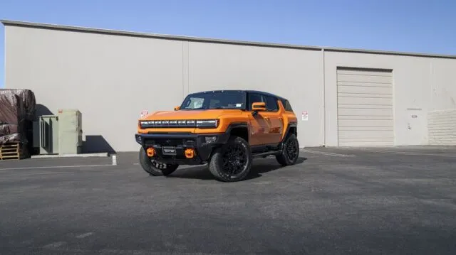GMC Hummer EV Orange PPF Black Wheels Lift Kit Front 3Quarter