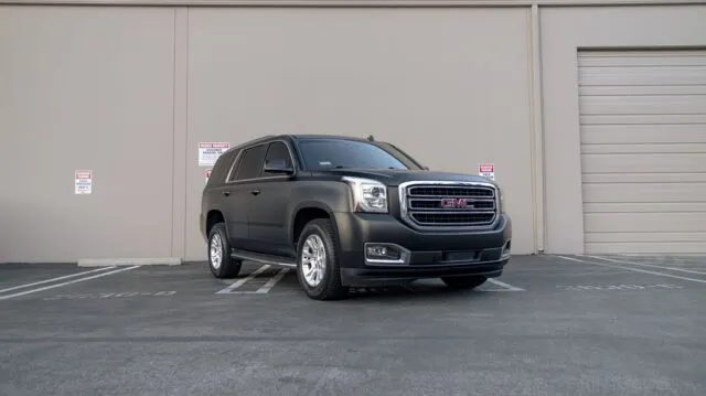 GMC Yukon Matte Black Vinyl Wrap Front 3 4