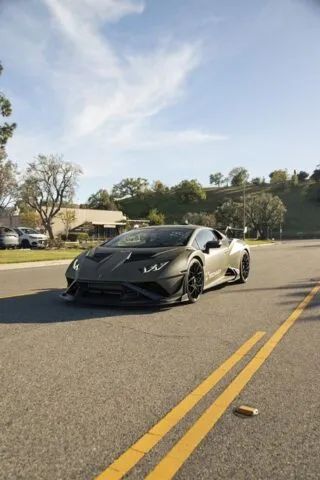 Lamborghini Huracan STO Matte Army Green Vinyl Wrap Front 3Quarter Street Golden Hour