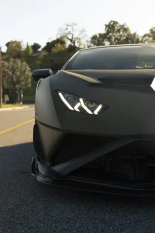 Lamborghini Huracan STO Matte Army Green Vinyl Wrap Headlight Front Close Up Dusk