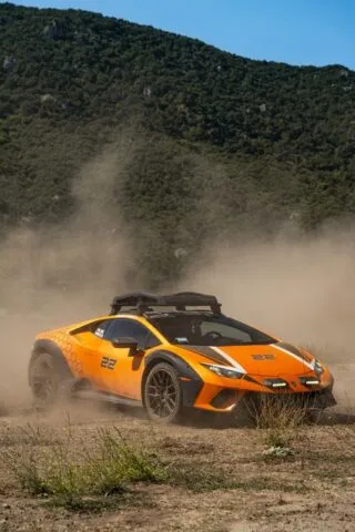 Lamborghini Huracan Sterrato Orange Vinyl Wrap Front Action Dust Mountain