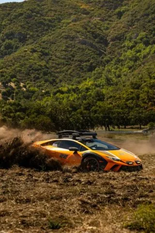 Lamborghini Huracan Sterrato Orange Vinyl Wrap Side Action Dirt Roost Mountain