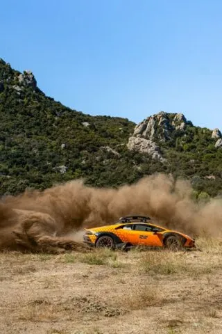 Lamborghini Huracan Sterrato Orange Vinyl Wrap Side Action Dust Roost Mountain