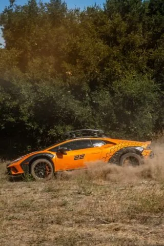 Lamborghini Huracan Sterrato Orange Vinyl Wrap Side Action Dust