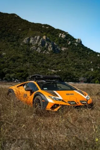 Lamborghini Huracan Sterrato Orange Vinyl Wrap Three Quarter Front Field