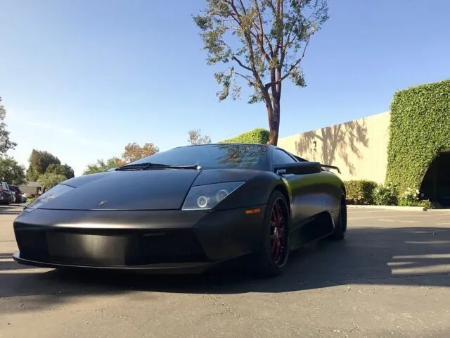 Lamborghini Murcielago Matte Black Vinyl Wrap Front Low Angle Parking Lot