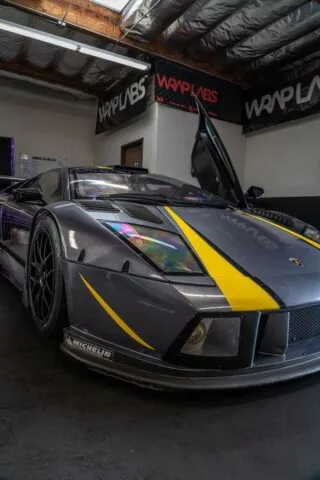 Lamborghini Murcielago Race Car Matte Grey Yellow Stripes Vinyl Wrap Front Closeup WrapLabs Shop