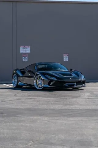 Ferrari F8 Tributo Gloss Black Front 3 4 Warehouse Wall