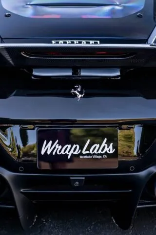 Ferrari Gloss Black Rear Emblem and License Plate Detail