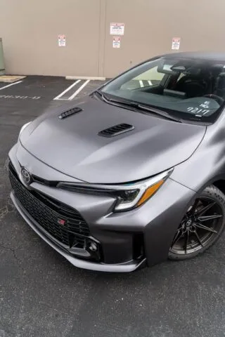 Toyota GR Corolla Satin Grey Front 3 4 Parking Lot