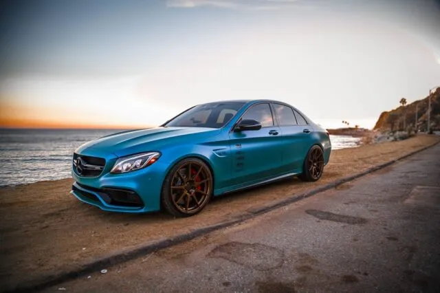 Mercedes AMG C63 Teal Blue Vinyl Wrap Side Profile Oceanside Sunset