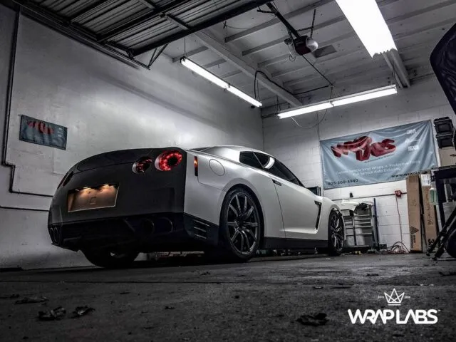 Nissan GT R Matte White Vinyl Wrap Rear Low Angle WrapLabs Shop Indoor