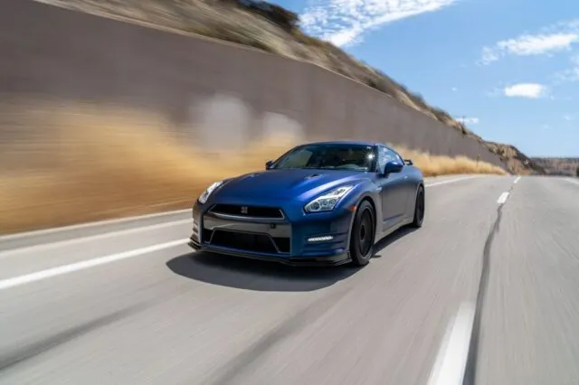 Nissan GT R R35 Matte Blue Vinyl Wrap Rolling Front Highway