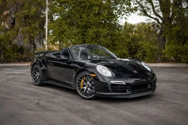Porsche 911 Turbo S Cabriolet Black PPF Front Three Quarter Trees