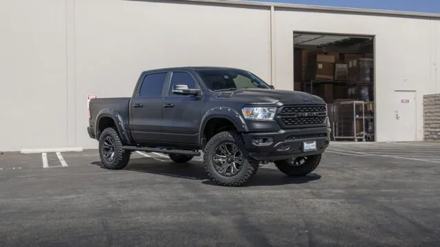 RAM 1500 Matte Black Vinyl Wrap Lifted Black Wheels Front 3Quarter