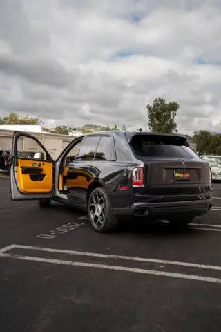 Rolls Royce Cullinan Black Badge Graphite Yellow Interior Rear Three Quarter Doors Open
