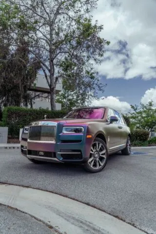 Rolls Royce Cullinan Color Shift Chameleon Vinyl Wrap Front 3Quarter Vertical Street Trees