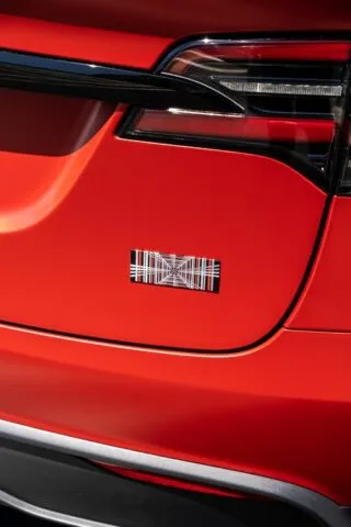 Tesla Model X Matte Red Color pain protection film Rear Quarter Badge Closeup