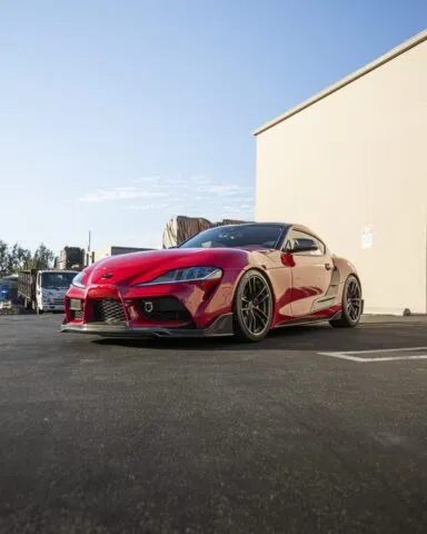Toyota GR Supra Red PPF Carbon Splitter Front 3Quarter Low Street