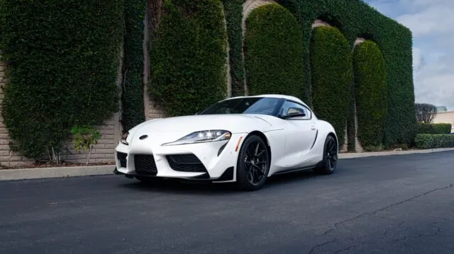 Toyota GR Supra White Paint Protection Film Front Three Quarter Hedge Wall
