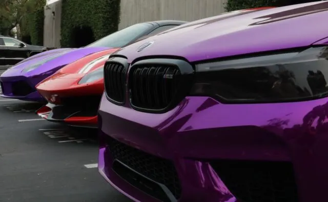 WrapLabs Shop BMW M5 Purple Chrome Ferrari 488 Red Lamborghini Purple Multi Car Lineup Grille Close