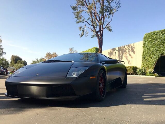 Lamborghini Murcielago Matte Black Vinyl Wrap Front Low Angle Parking Lot, by Wrap Labs, Westlake Village