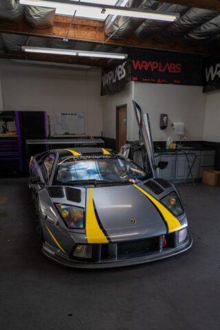 Lamborghini Murcielago Race Car Matte Grey Yellow Stripes Vinyl Wrap Front 3Quarter WrapLabs Shop, by Wrap Labs, Westlake Village