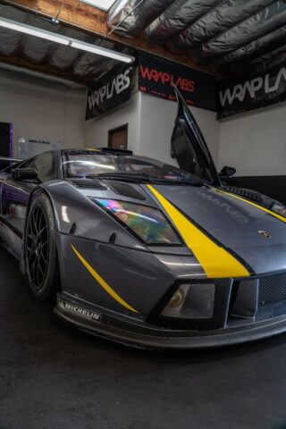 Lamborghini Murcielago Race Car Matte Grey Yellow Stripes Vinyl Wrap Front Closeup WrapLabs Shop, by Wrap Labs, Westlake Village