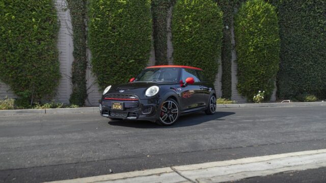 MINI Cooper JCW Black Red Roof Mirror Vinyl Wrap Front 3Quarter Hedge Wall, by Wrap Labs, Westlake Village
