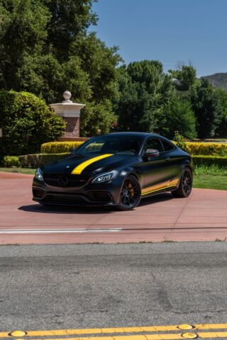 Mercedes AMG C63 S Matte Black Yellow Stripe Vinyl Wrap Front 3Quarter Low Angle, by Wrap Labs, Westlake Village