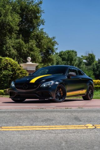 Mercedes AMG C63 S Matte Black Yellow Stripe Vinyl Wrap Front 3Quarter Street Trees, by Wrap Labs, Westlake Village