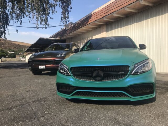 Mercedes AMG C63 Teal Green Vinyl Wrap Porsche Cayenne Chameleon Two Car Shot, by Wrap Labs, Westlake Village