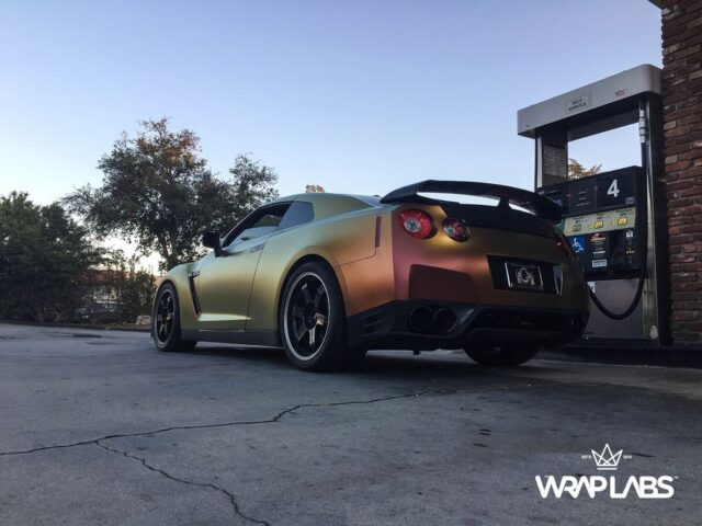 Nissan GT R Color Shift Gold Copper Vinyl Wrap Rear Three Quarter Gas Station, by Wrap Labs, Westlake Village
