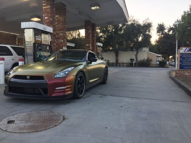 Nissan GT R Color Shift Gold Red Vinyl Wrap Front Three Quarter Gas Station, by Wrap Labs, Westlake Village