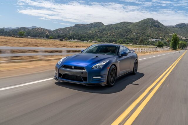 Nissan GT R R35 Matte Blue Vinyl Wrap Rolling Front Straight Rural Road, by Wrap Labs, Westlake Village