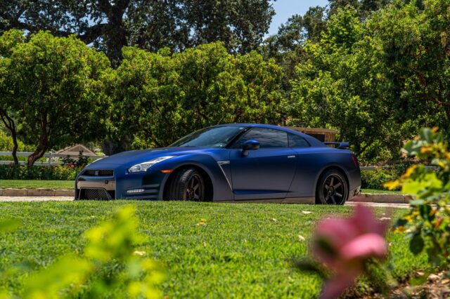 Nissan GT R R35 Matte Blue Vinyl Wrap Side Profile Garden Foreground v1, by Wrap Labs, Westlake Village