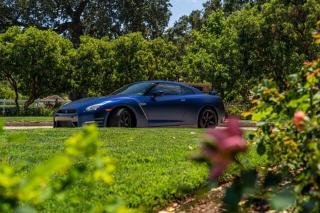 Nissan GT R R35 Matte Blue Vinyl Wrap Side Profile Garden Foreground v2, by Wrap Labs, Westlake Village
