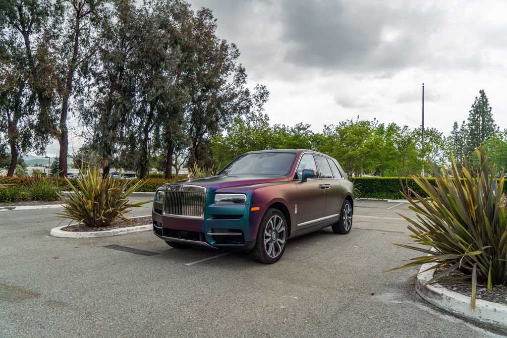 Rolls Royce Cullinan Color Shift Chameleon Vinyl Wrap Front 3Quarter Parking Lot Plants