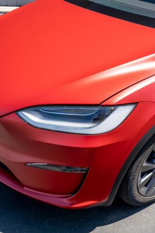 Tesla Model X Matte Red CPF Front Headlight Hood Closeup, by Wrap Labs, Westlake Village